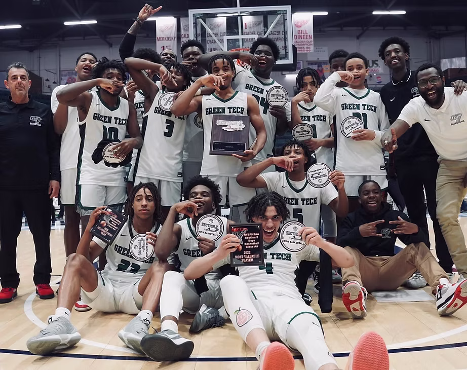 Green Tech High Eagles basketball team celebrating the 2021 Section II championship