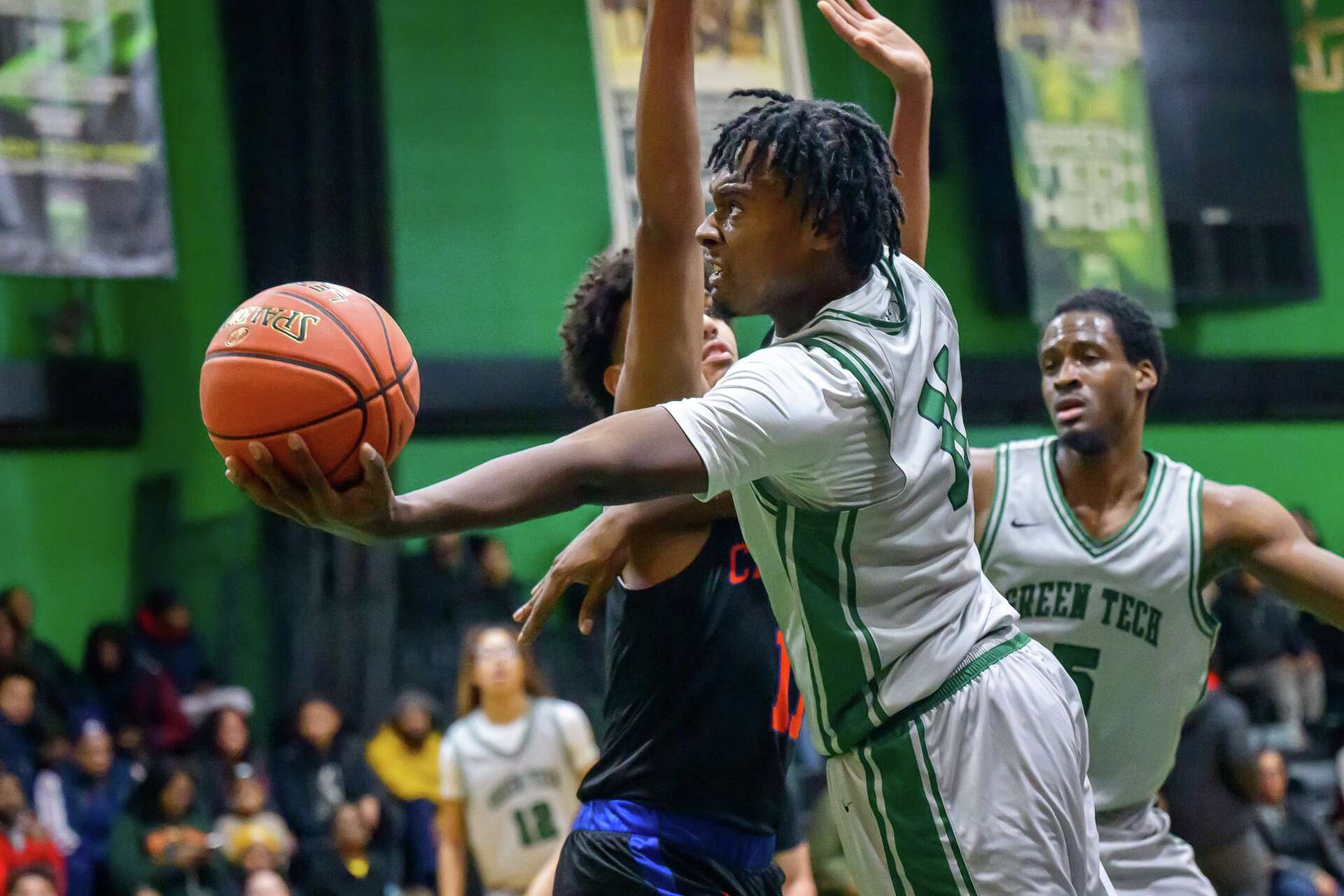 Green Tech Eagles player driving to the basket during a home game